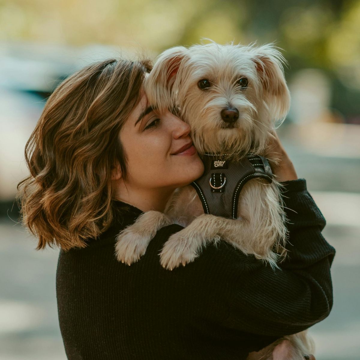 women holding dog